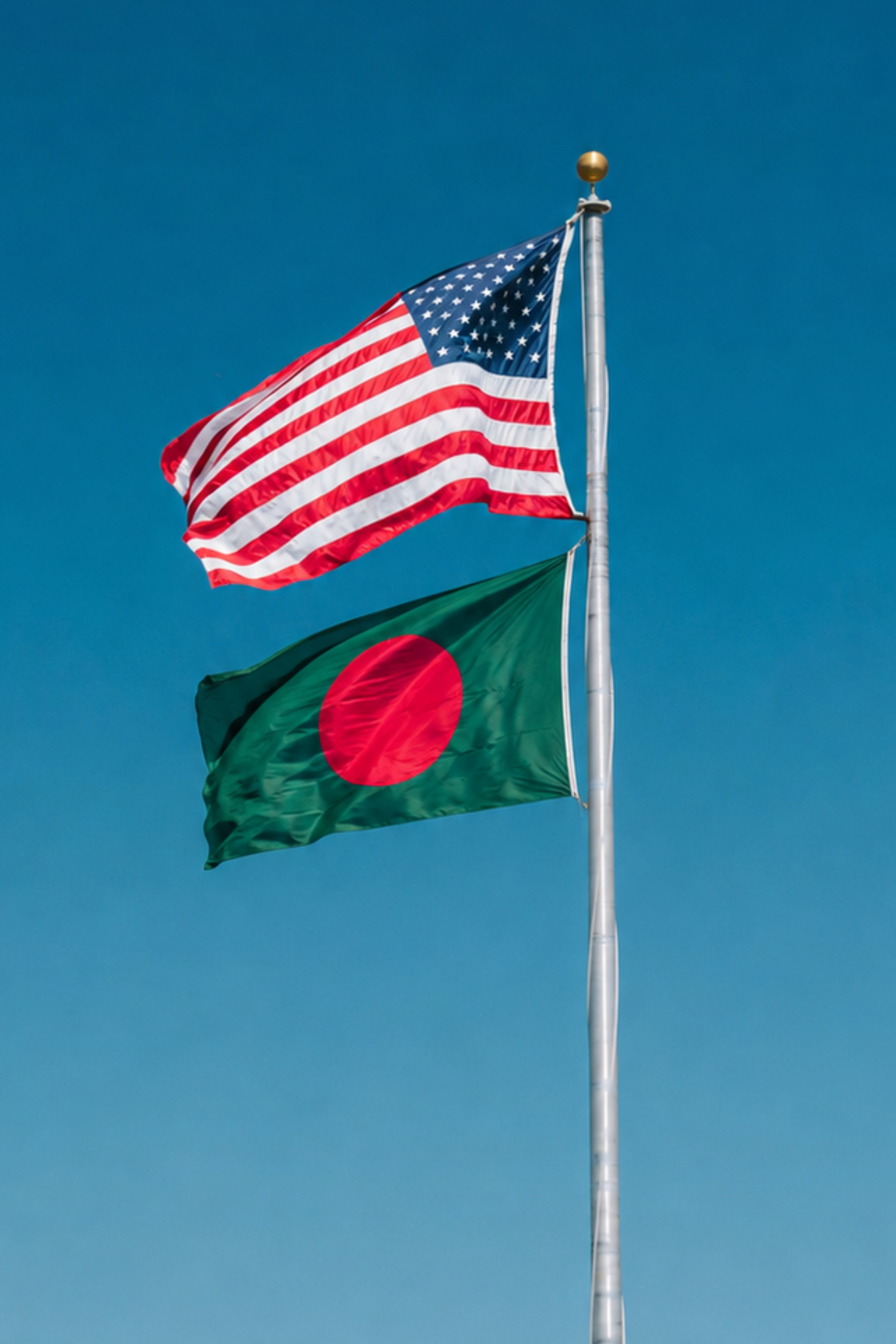 The flags of the United States and Bangladesh flying together